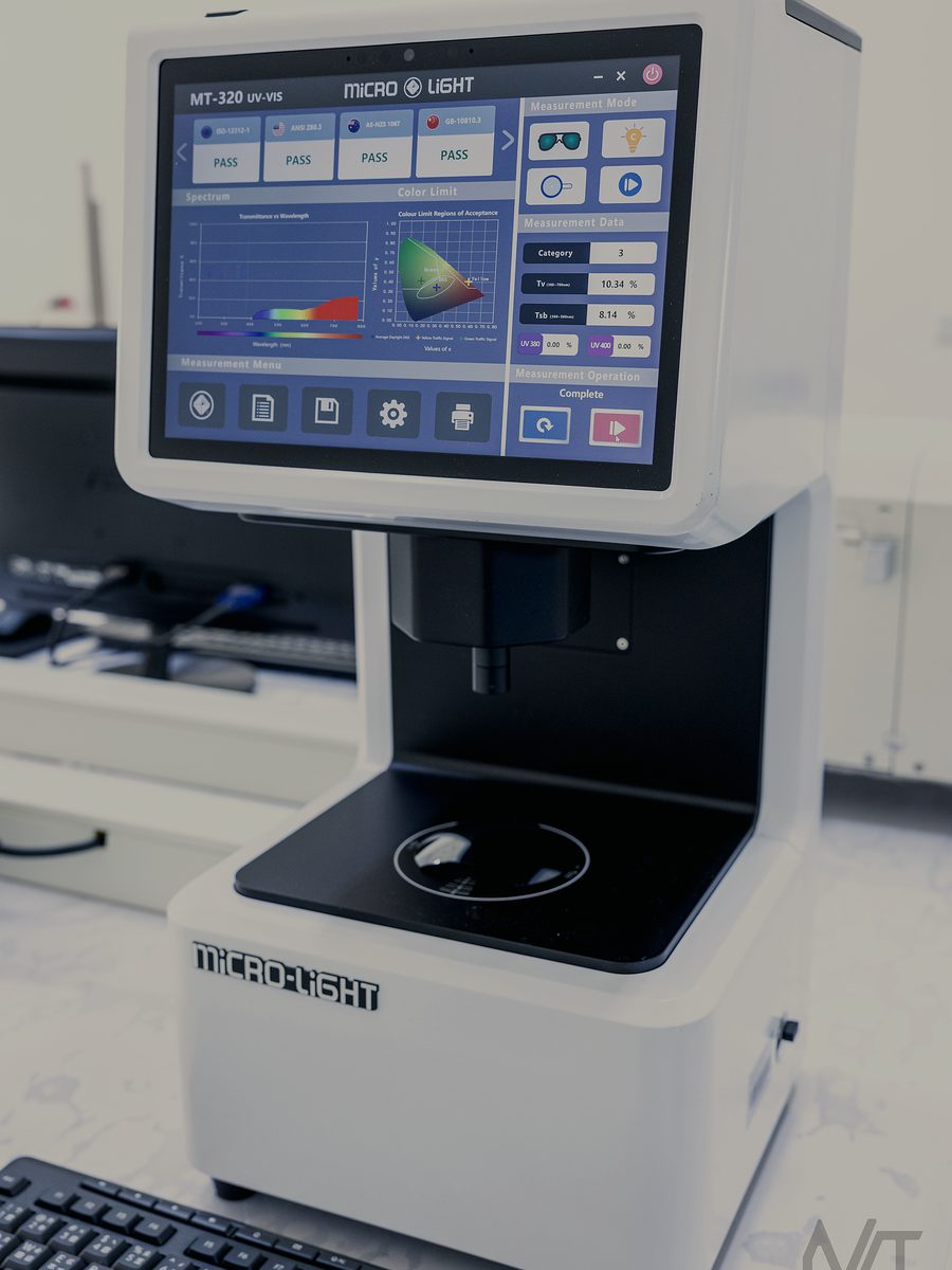 UV-VIS spectrophotometer showing a pass result against four eyewear standards